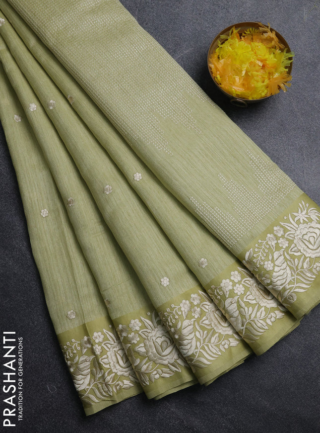 Jute silk saree pista green with embroidery buttas and parsi embroidery border