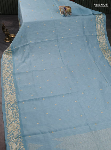 Jute silk saree pastel blue with embroidery buttas and parsi embroidery border