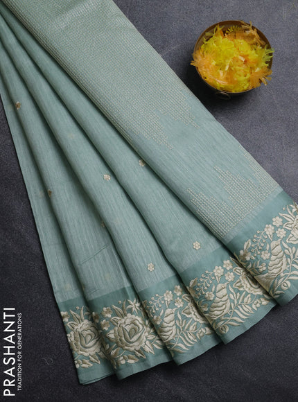Jute silk saree pastel green with embroidery buttas and parsi embroidery border