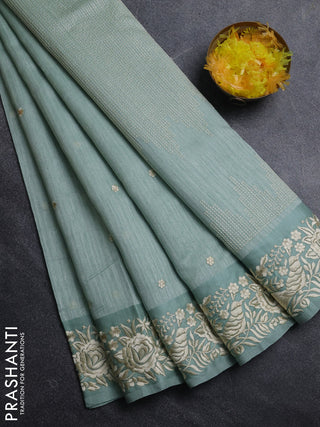 Jute silk saree pastel green with embroidery buttas and parsi embroidery border
