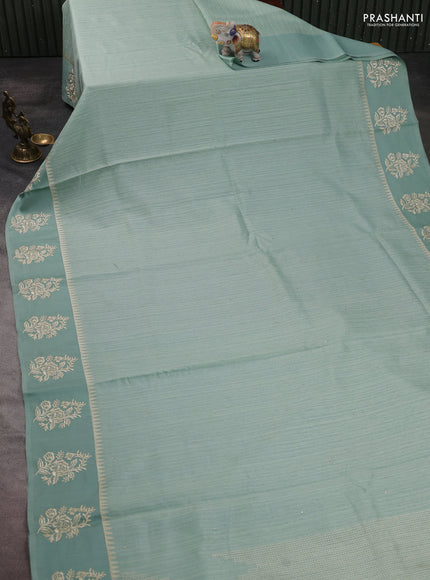 Jute silk saree pastel green with embroidery buttas and floral embroidery butta border