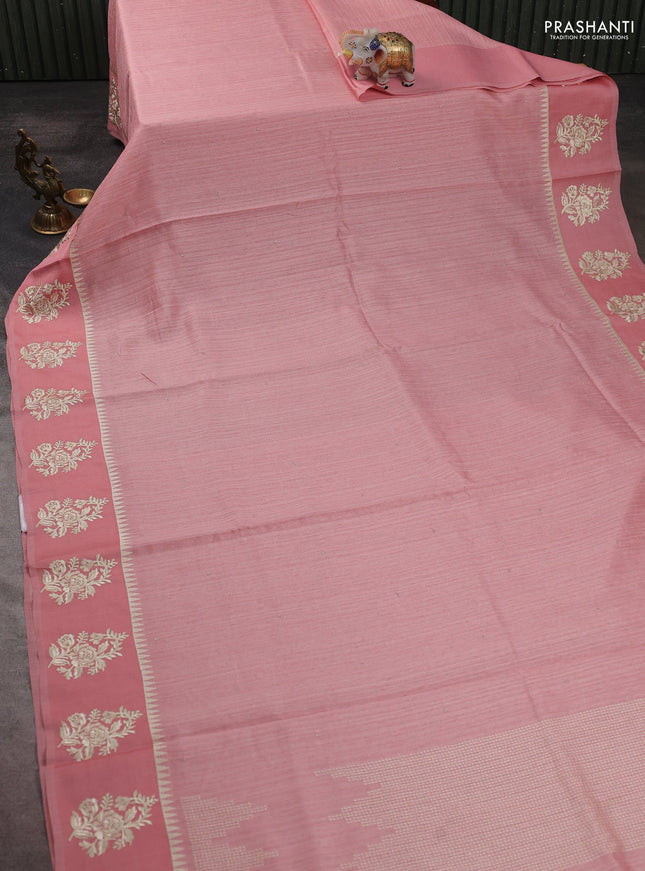 Jute silk saree peach shade with embroidery buttas and floral embroidery butta border