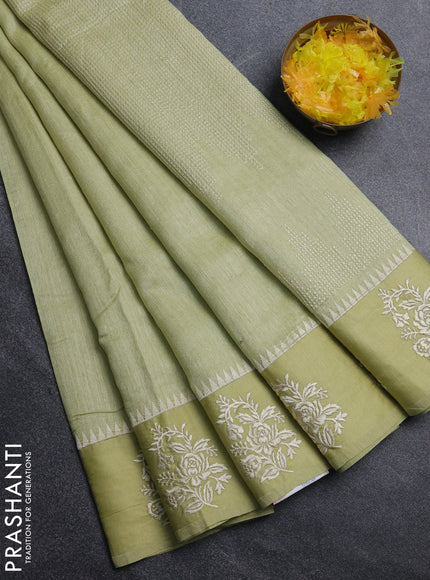 Jute silk saree pista green with embroidery buttas and floral embroidery butta border