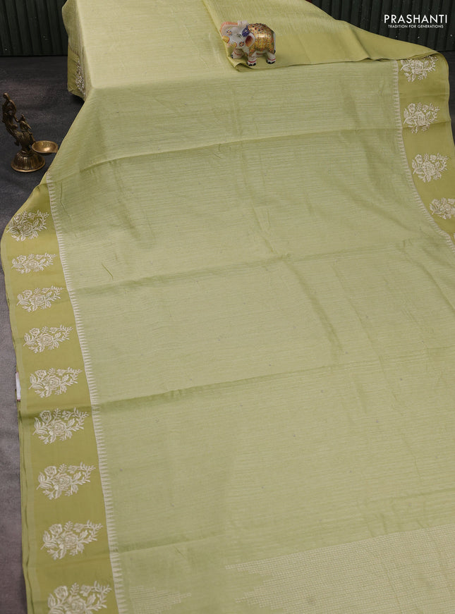 Jute silk saree pista green with embroidery buttas and floral embroidery butta border