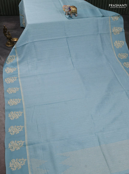 Jute silk saree pastel blue with embroidery buttas and floral embroidery butta border