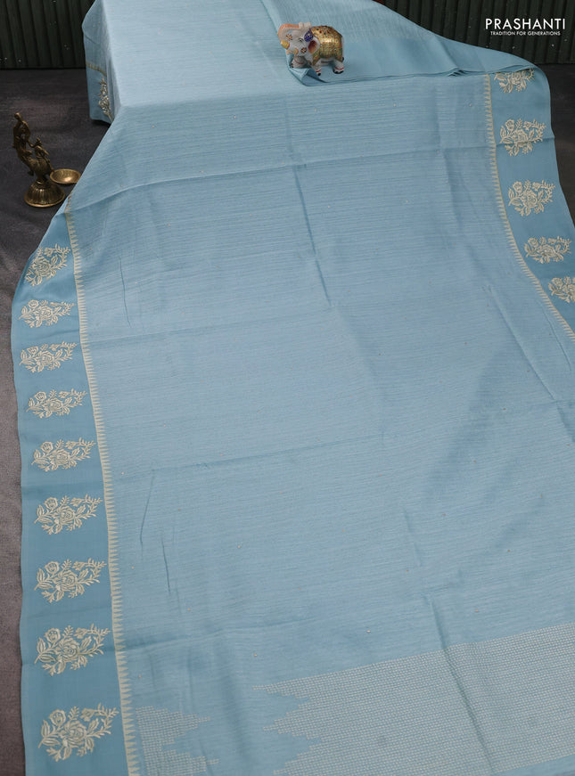 Jute silk saree pastel blue with embroidery buttas and floral embroidery butta border