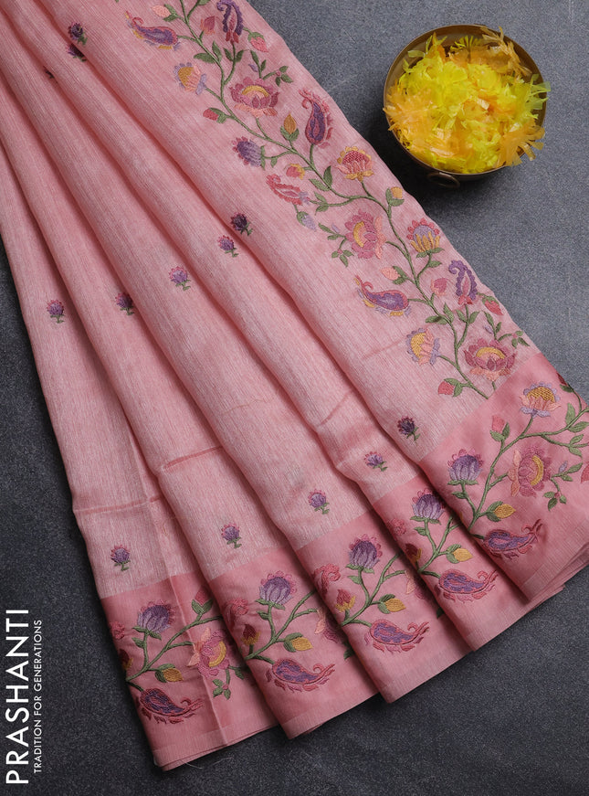 Jute silk saree peach shade with embroidery buttas and floral embroidery butta border