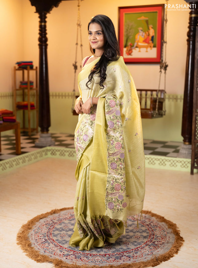 Jute silk saree pista green with embroidery buttas and long parsi embroidery simple border