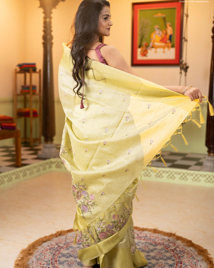 Jute silk saree pista green with embroidery buttas and long parsi embroidery simple border