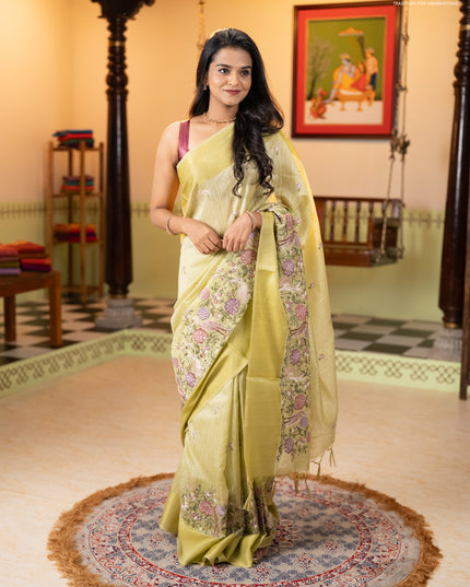Jute silk saree pista green with embroidery buttas and long parsi embroidery simple border