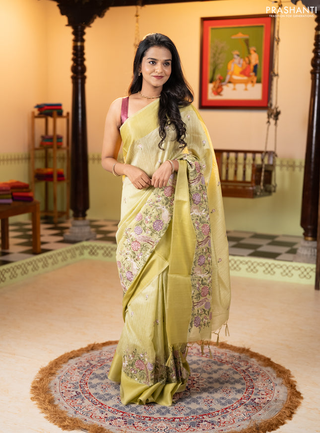 Jute silk saree pista green with embroidery buttas and long parsi embroidery simple border