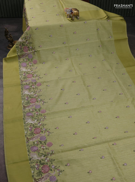 Jute silk saree pista green with embroidery buttas and long parsi embroidery simple border