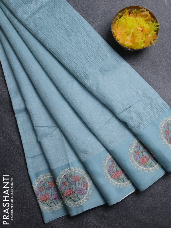 Jute silk saree pastel blue with embroidery buttas and floral embroidery butta border