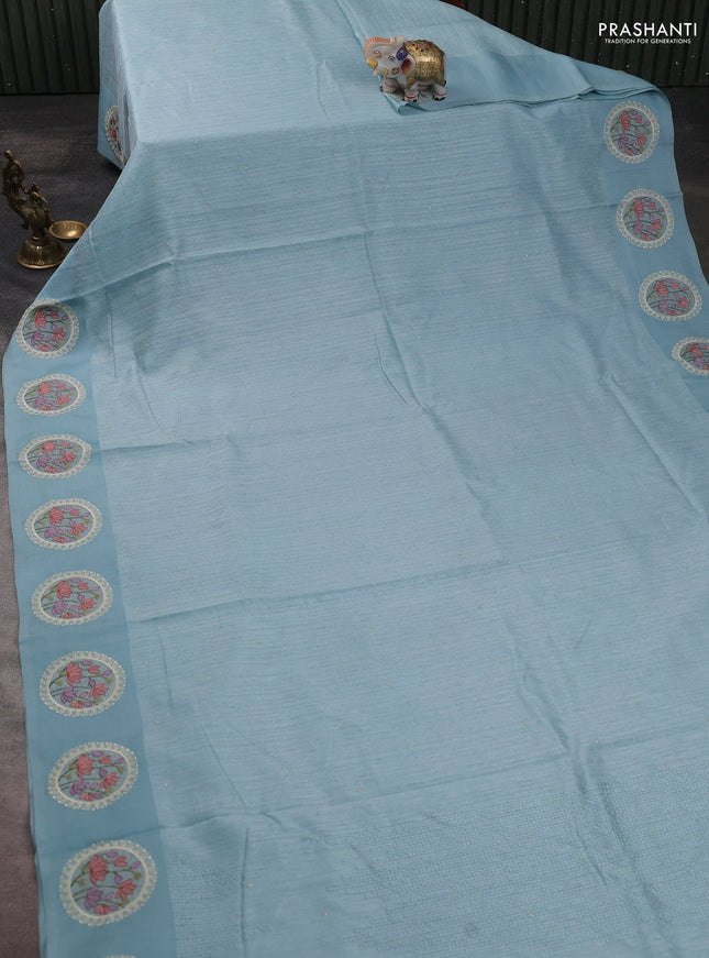 Jute silk saree pastel blue with embroidery buttas and floral embroidery butta border