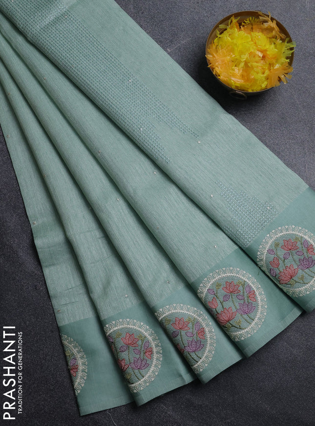 Jute silk saree pastel green with embroidery buttas and floral embroidery butta border