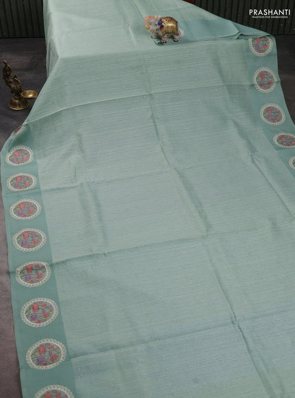 Jute silk saree pastel green with embroidery buttas and floral embroidery butta border