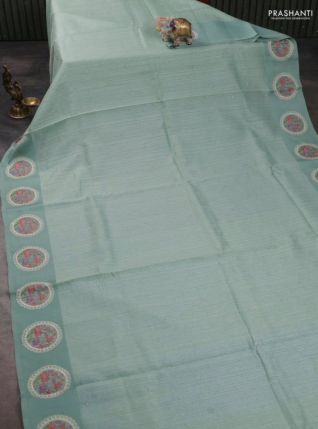 Jute silk saree pastel green with embroidery buttas and floral embroidery butta border