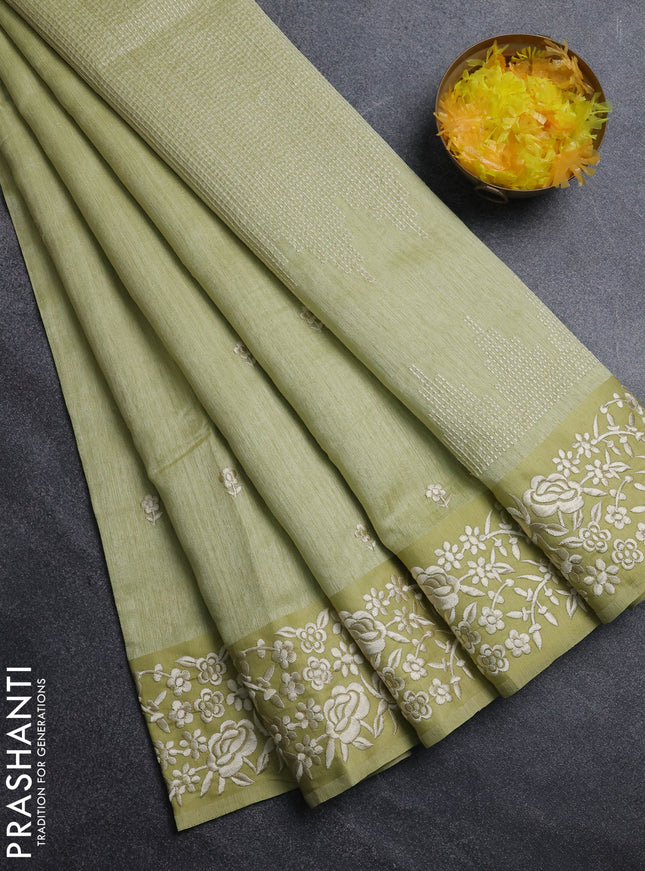 Jute silk saree pista green with embroidery buttas and embroidery border