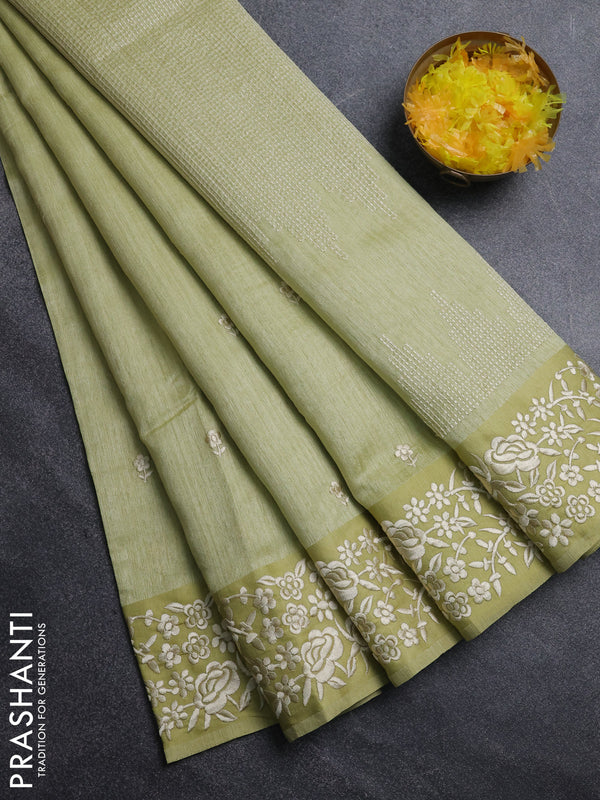 Jute silk saree pista green with embroidery buttas and embroidery border