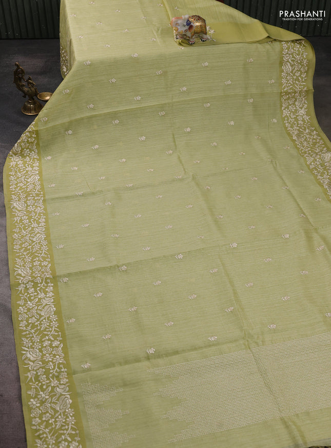 Jute silk saree pista green with embroidery buttas and embroidery border