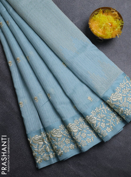Jute silk saree pastel blue with embroidery buttas and embroidery border