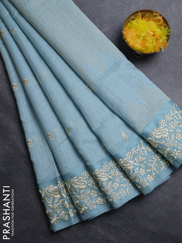 Jute silk saree pastel blue with embroidery buttas and embroidery border