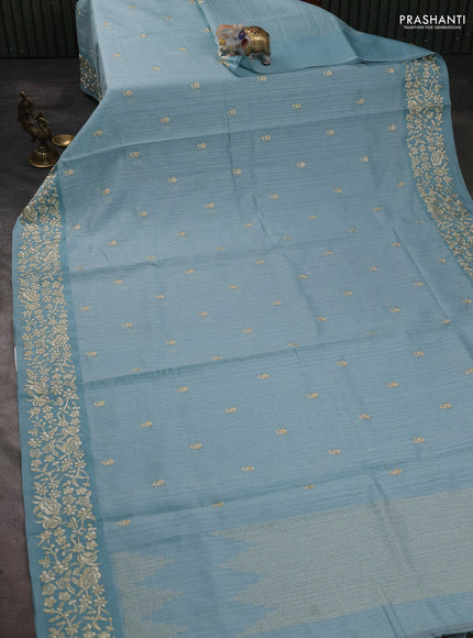 Jute silk saree pastel blue with embroidery buttas and embroidery border