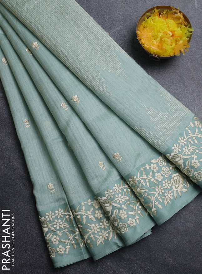 Jute silk saree pastel green with embroidery buttas and embroidery border