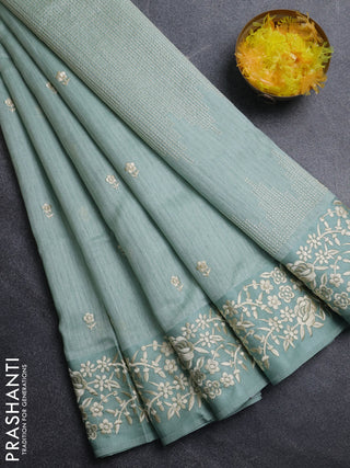 Jute silk saree pastel green with embroidery buttas and embroidery border