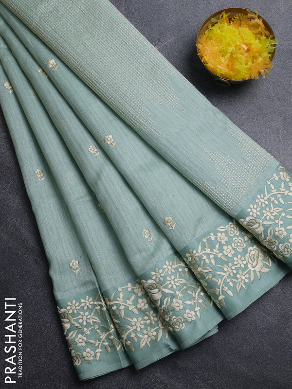 Jute silk saree pastel green with embroidery buttas and embroidery border
