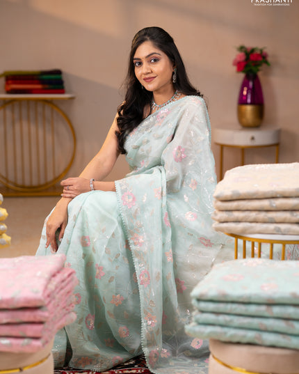 Pure organza silk saree pastel blue shade with allover embroidery sequin work and embroidery crocia lace work border