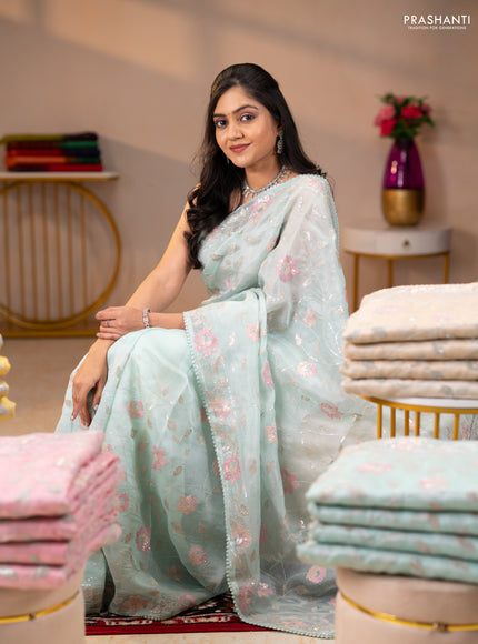 Pure organza silk saree pastel blue shade with allover embroidery sequin work and embroidery crocia lace work border