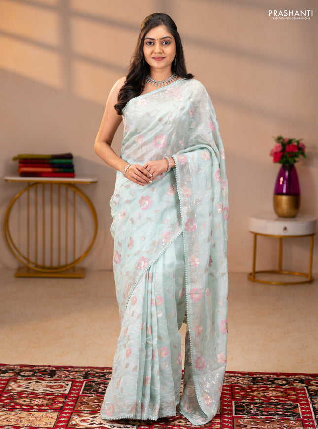 Pure organza silk saree pastel blue shade with allover embroidery sequin work and embroidery crocia lace work border