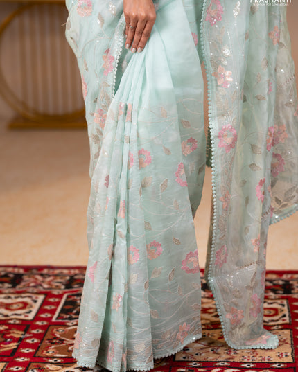Pure organza silk saree pastel blue shade with allover embroidery sequin work and embroidery crocia lace work border
