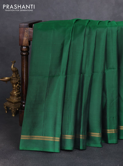 Pure soft silk saree dark green and yellow with plain body and kalamkari hand printed pallu