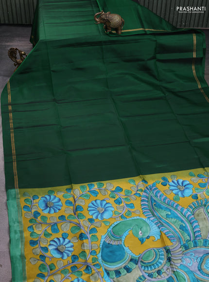 Pure soft silk saree dark green and yellow with plain body and kalamkari hand printed pallu