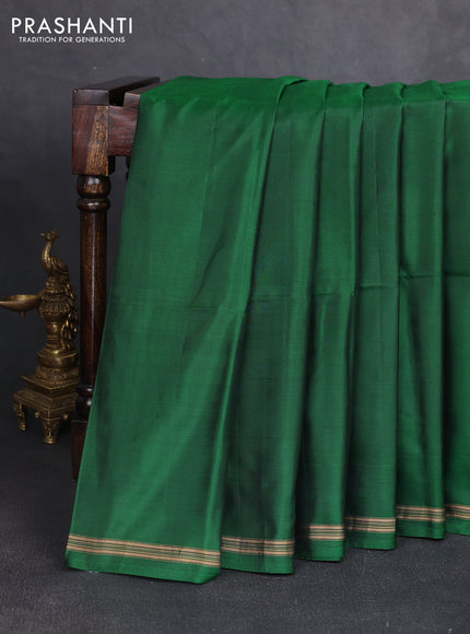 Pure soft silk saree dark green and rustic orange with plain body and kalamkari hand printed pallu