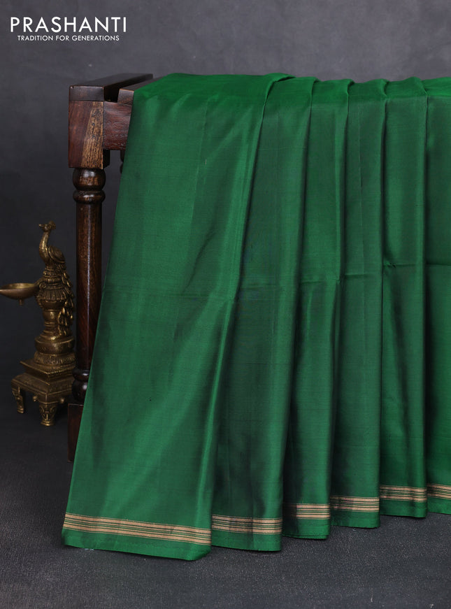 Pure soft silk saree dark green and rustic orange with plain body and kalamkari hand printed pallu