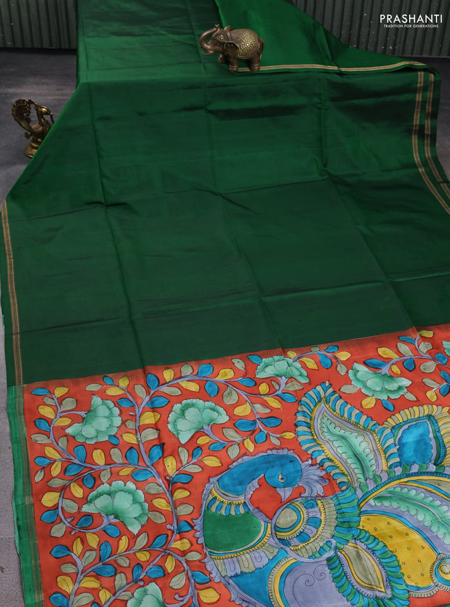 Pure soft silk saree dark green and rustic orange with plain body and kalamkari hand printed pallu