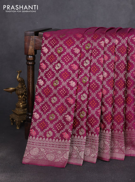 Banarasi silk saree wine shade with allover zari woven brocade weaves and zari woven border