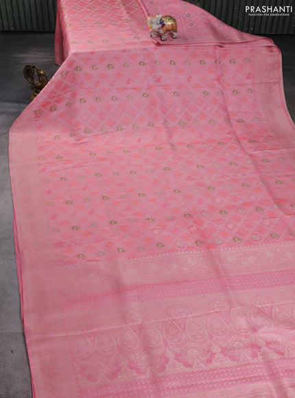 Banarasi silk saree mild peach pink with allover zari woven brocade weaves and zari woven border