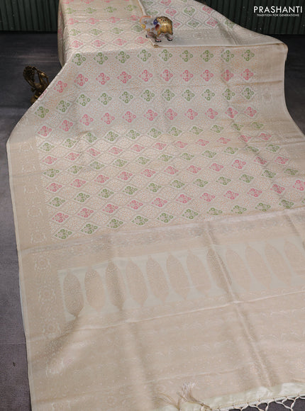 Banarasi silk saree cream with allover zari woven brocade weaves and zari woven border