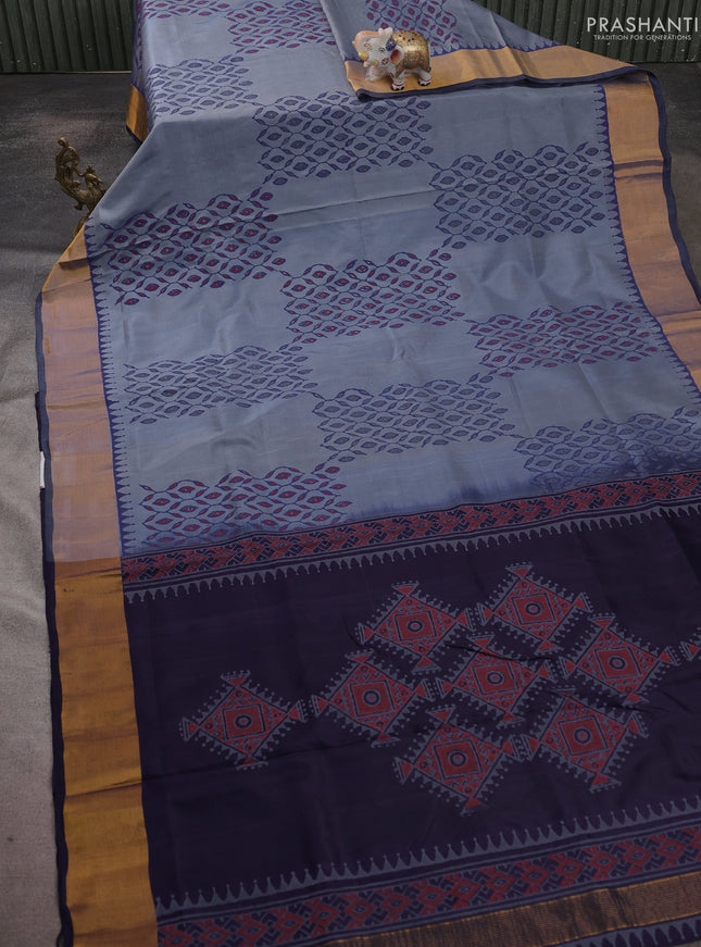 Uppada block printed saree greyish blue and navy blue with prints and zari woven border