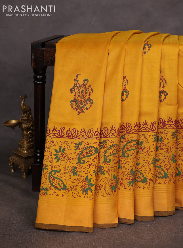 Uppada block printed saree mustard yellow and coffee brown with butta prints and long printed zari woven border