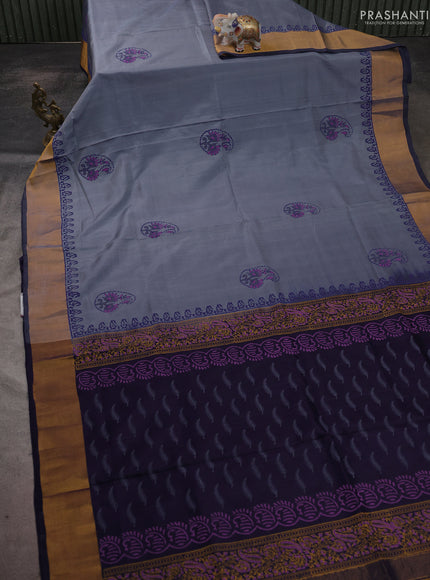 Uppada block printed saree greyish blue and navy blue with butta prints and zari woven border