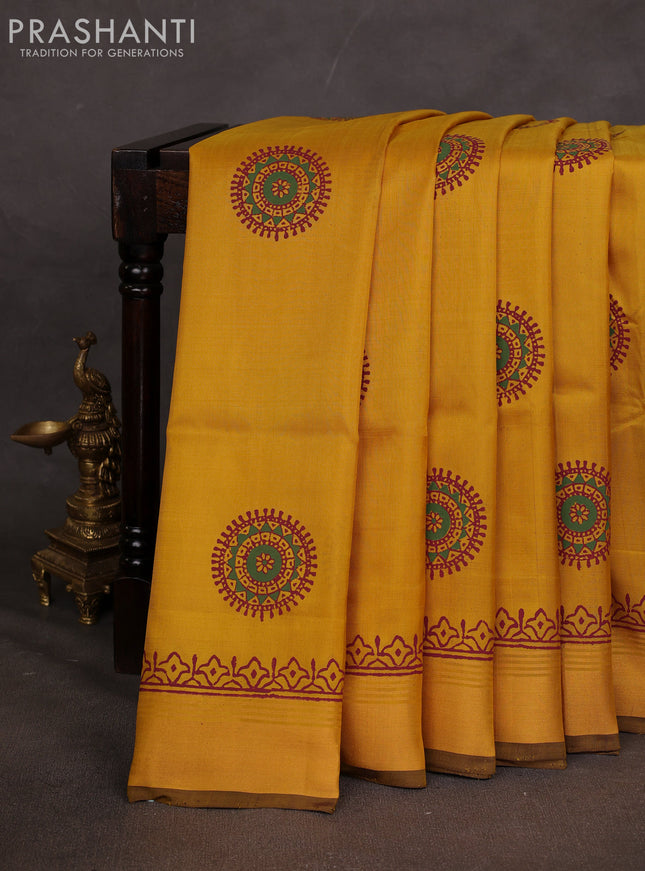 Uppada block printed saree mustard yellow and coffee brown with butta prints and zari woven border