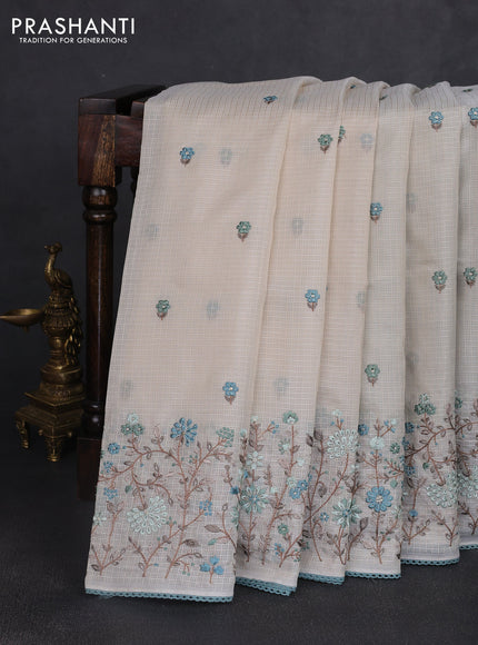Kota silk saree beige and pastel blue with embroidery work and floral embroidery corcia lace border