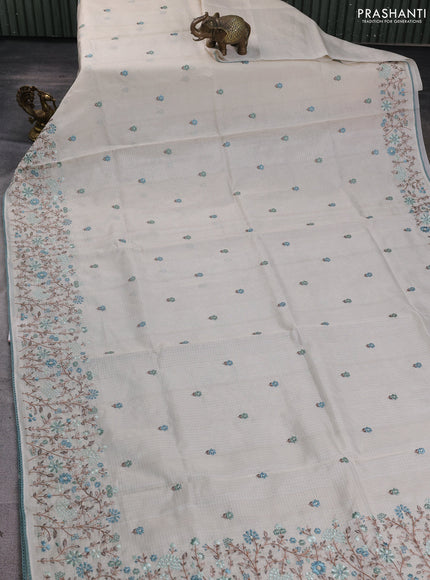 Kota silk saree beige and pastel blue with embroidery work and floral embroidery corcia lace border