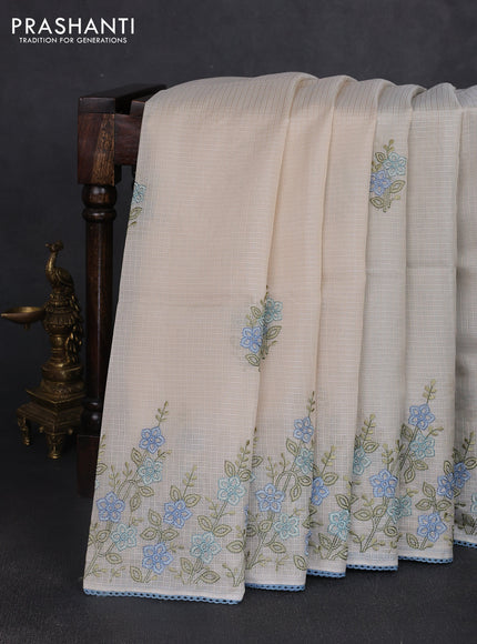 Kota silk saree beige and pastel blue with embroidery work and floral embroidery corcia lace border