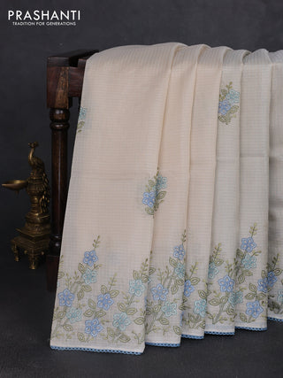 Kota silk saree beige and pastel blue with embroidery work and floral embroidery corcia lace border